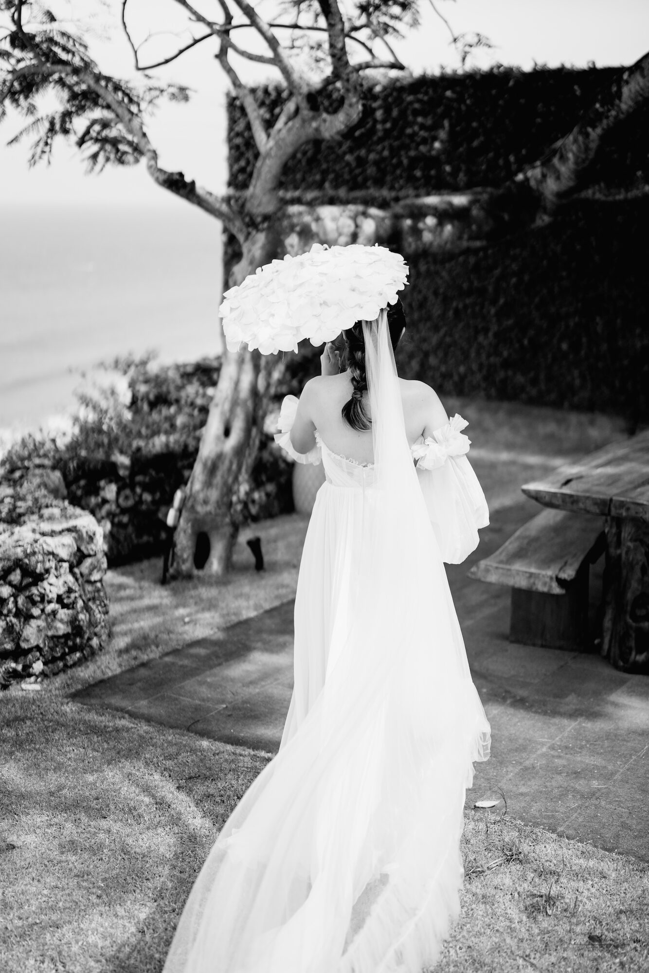 Bride with a parasol at an intimate Bali ceremony